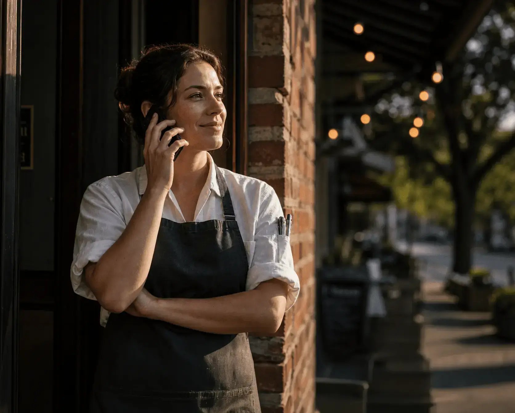 Firefly_gpt-image_Candid_photo_of_a_restaurant_worker_in_a_dark_apron_stepping_outside_on_a_break,_hold_411045_1